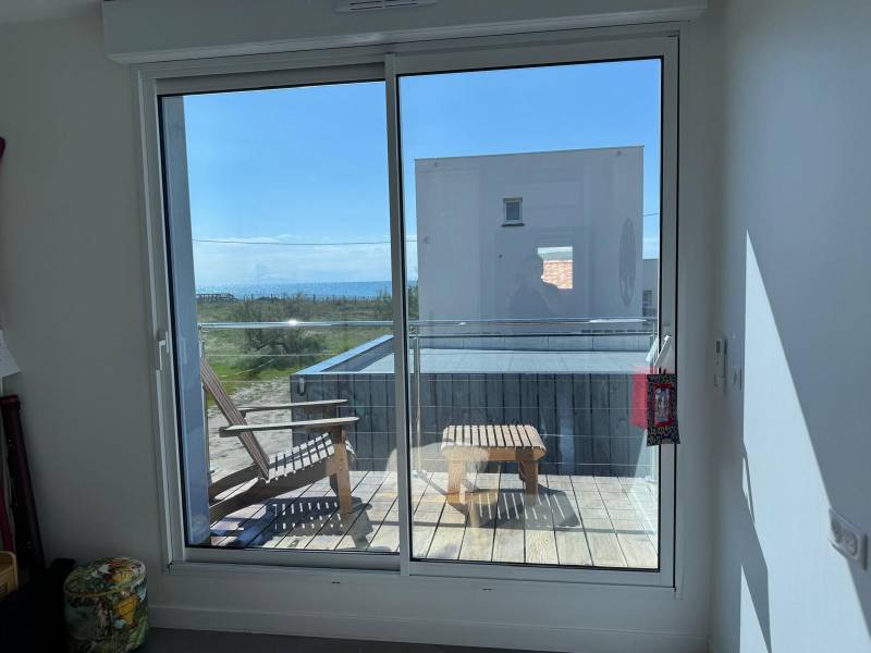 Installation de films de protection solaire sur baies vitrées existantes dans le 34