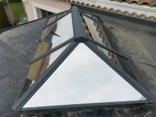 Pose de film solaire solarscreen sur la toit en verre d'une véranda entre Valence et Lyon, Rhône-Alpes